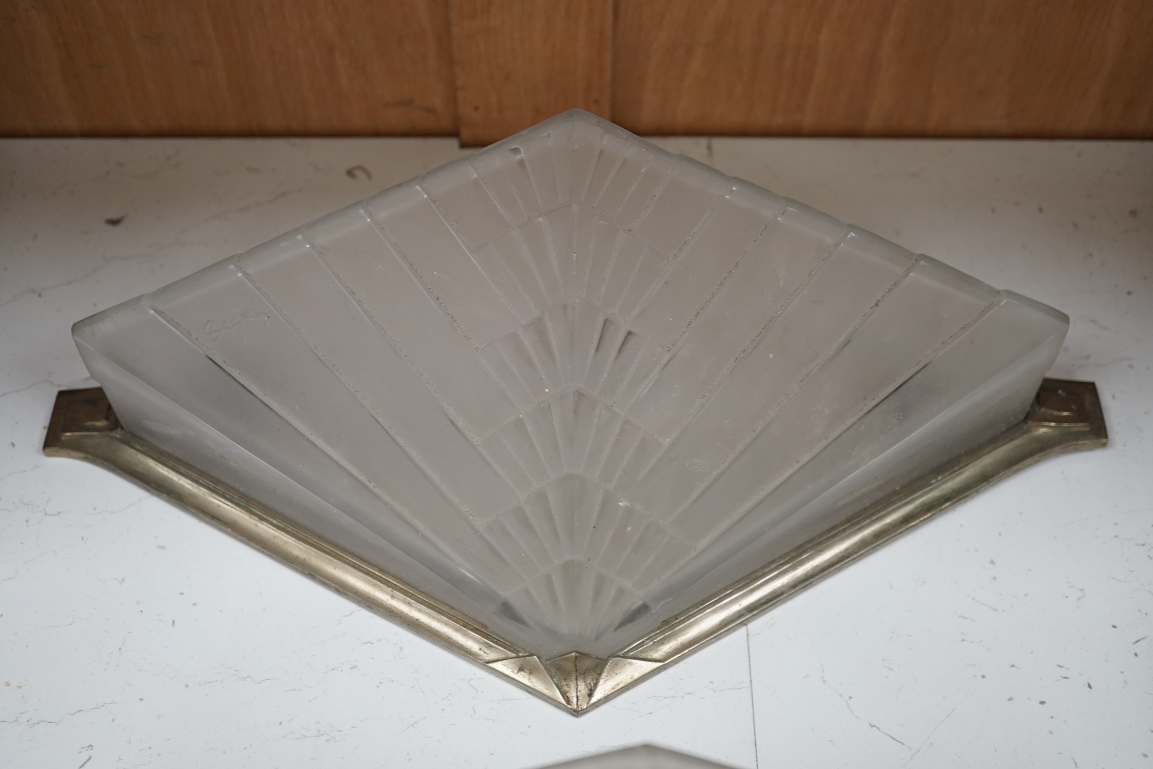 Two Art Deco wall lights with chrome frames by Degue, 40cm wide. Condition - fair, requires re wiring.